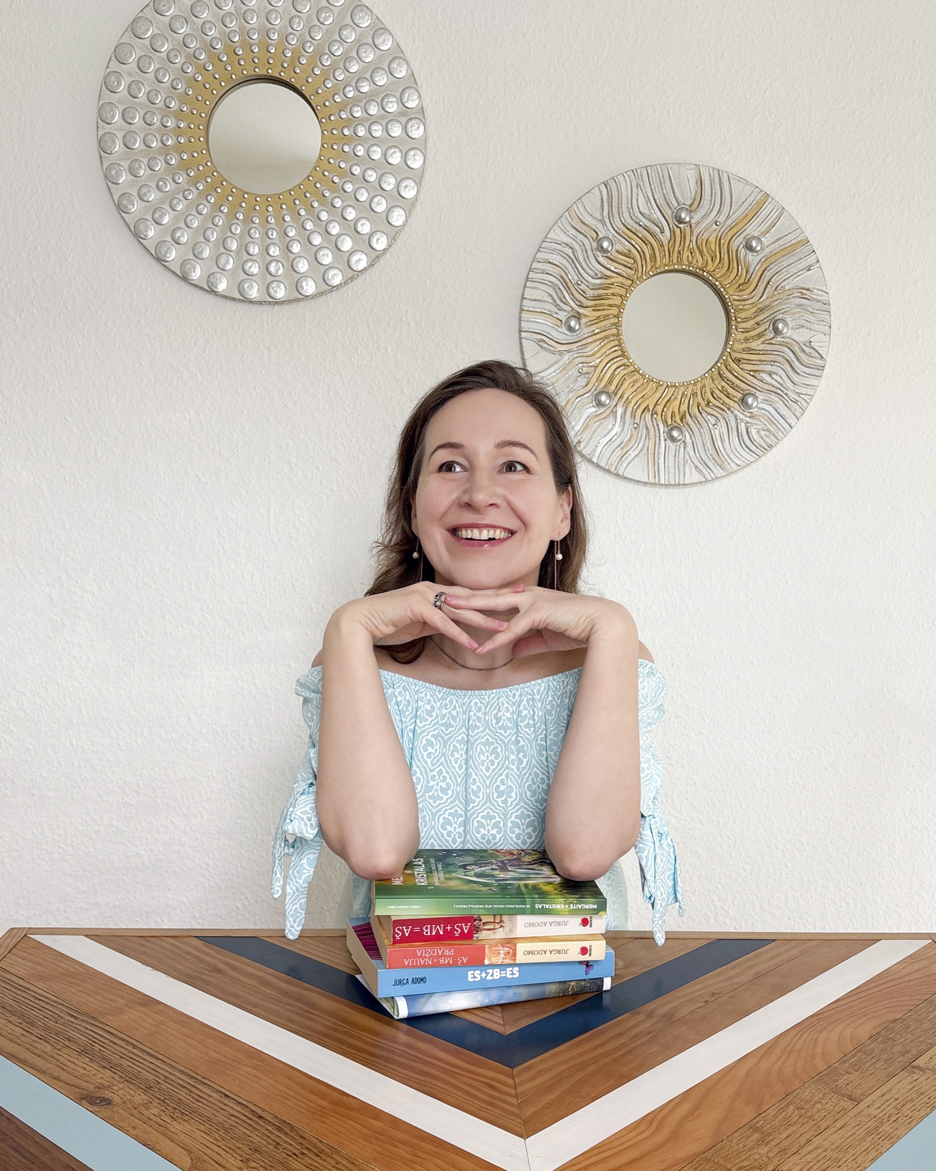 Jurga Nadin Luko at a table with her books